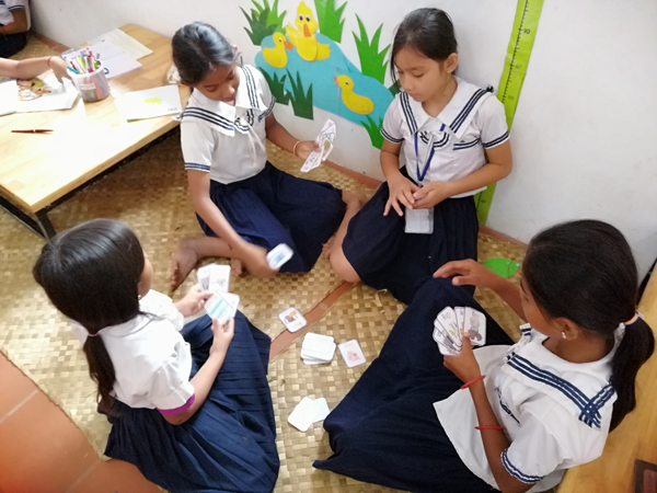 Primary school students playing in the library