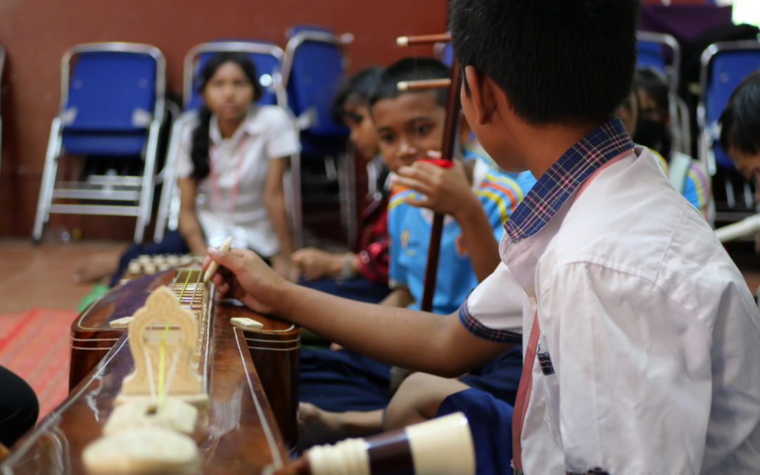 Primary school children playing music